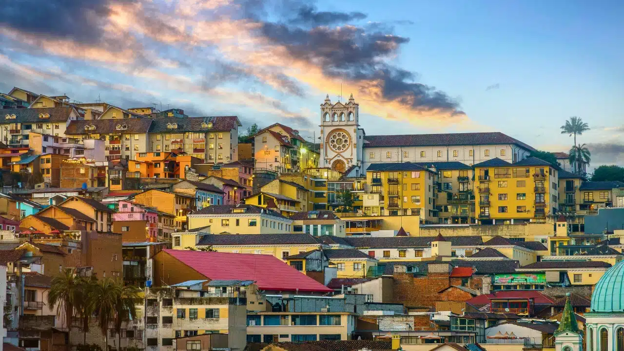 Antananarivo cityscape featuring vibrant hillside homes and a prominent church tower during sunset in Madagascar