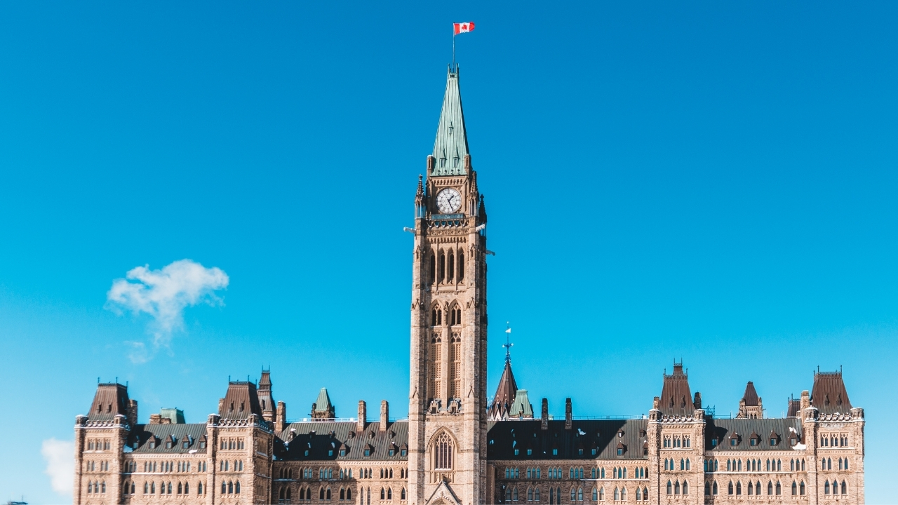 Peace Tower building under blue sky in Ottawa, Canada
